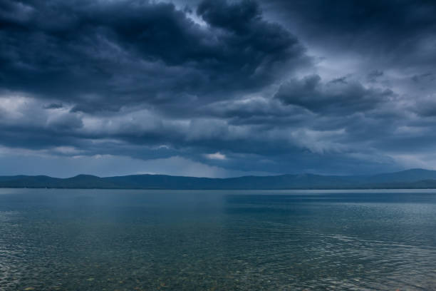 istock An impending cyclone with thunderstorms and squally winds on the lake 1265070836