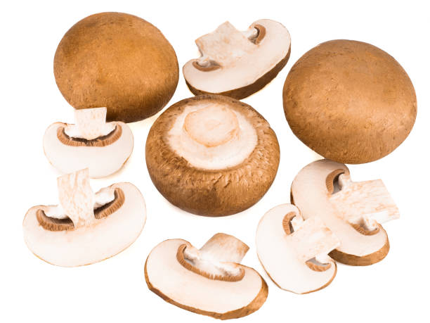 istock Champignons and their slices isolated on a white background 1265072112