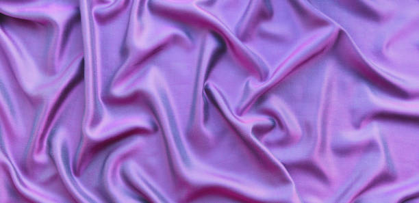 istock The draped fabric is pink with a shimmer in blue. 1265073501