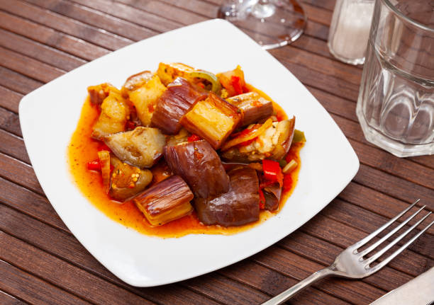 istock Appetizing stewed eggplant with onions and gravy 1265075924