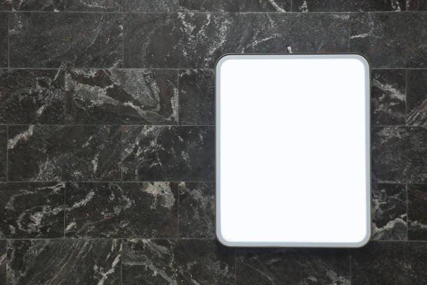 istock Light information panel on the wall of dark marble tiles 1265078822