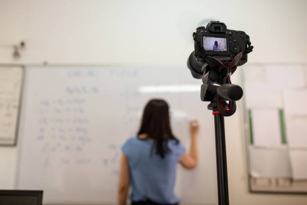 istock Young teacher holding online class during coronavirus pandemic 1265080771