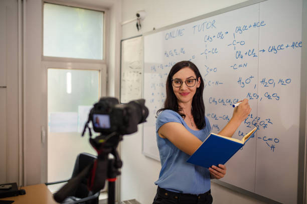 istock Female teacher is recording classes on a digital camera 1265080799