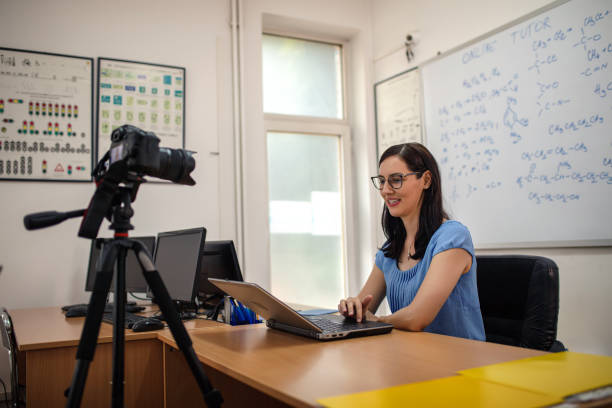 istock Female teacher is recording classes on a digital camera 1265080826