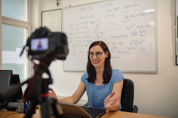 istock Female teacher is recording classes on a digital camera 1265080827