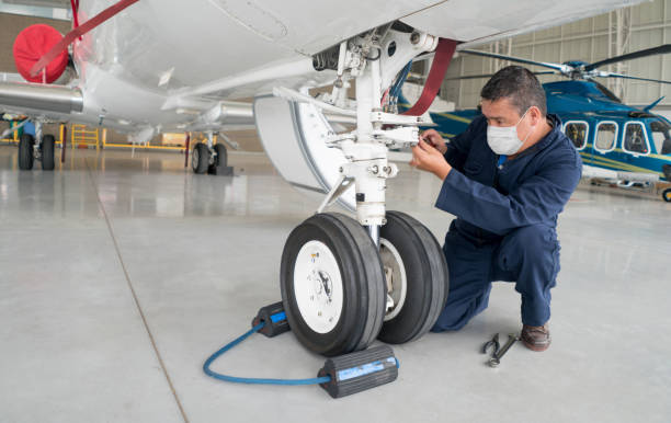 istock Engineer working at the airport wearing a facemask 1265081970