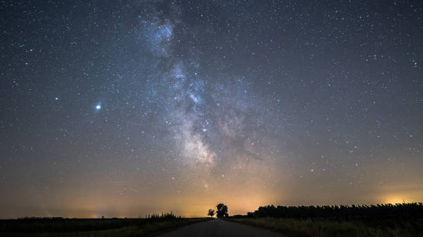 Fantastic Milky Way Scenery This beautiful Milky Way Time lapse was filmed close tho the Neusiedlersee in Austria. It was a phenomenal night capturing the Milky Way, Jupiter, Saturn and another phenomenon the glowing clouds. jupiter stock pictures, royalty-free photos & images