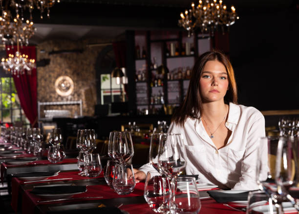 istock Woman sitting in luxury restaurant 1265083301