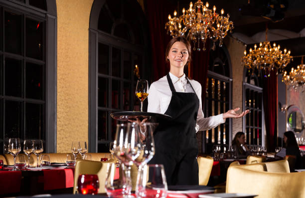 istock Portrait of cheerful young waitress 1265083311