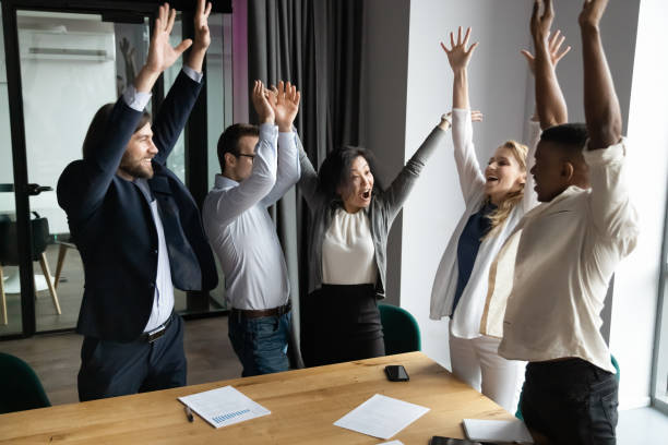 istock Excited diverse colleagues participate in motivational business training 1265084576