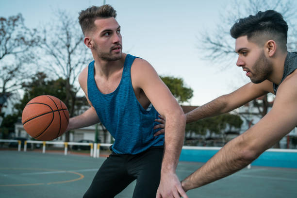 istock Young basketball players playing one-on-one. 1265084750