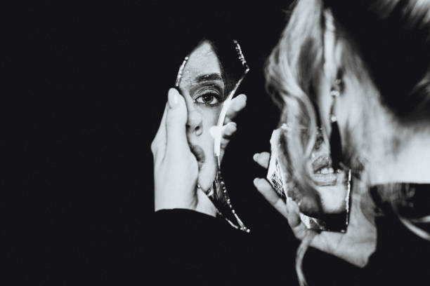 istock Retro girl and broken self-image mirror, black and white portrait 1265084827