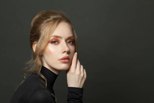 istock Lovely woman face on black background 1265084835