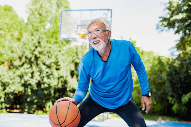 istock Active senior man playing basketball 1265087056