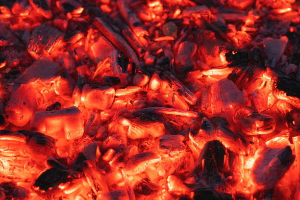 istock Smoldering charcoal in a bonfire, background texture 1265087149