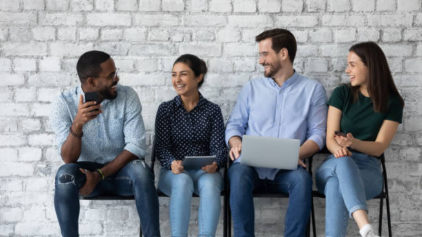 istock Young diverse candidates laughing, chatting, waiting for job interview 1265092943
