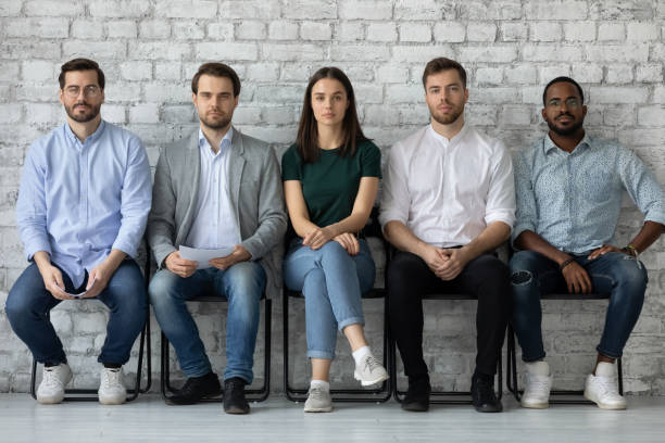 istock Portrait confident diverse candidates sitting in row, waiting for interview 1265092958