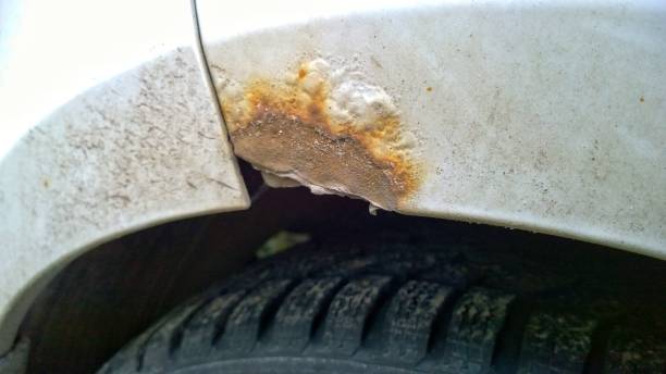 istock Car with rust, corrosion, defects and scratches, close up. How to remove rusty surface from a vehicle. Concept of providing quality restoration parts. Grunge dirty messy sheet metal. Copy space. 1265093129