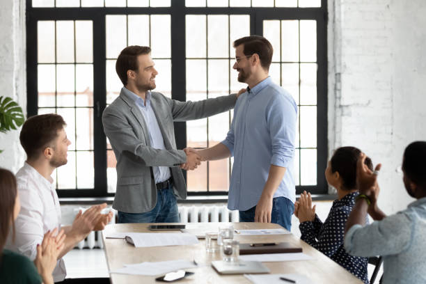 istock Smiling executive shaking successful employee hand, congratulating with promotion 1265093334