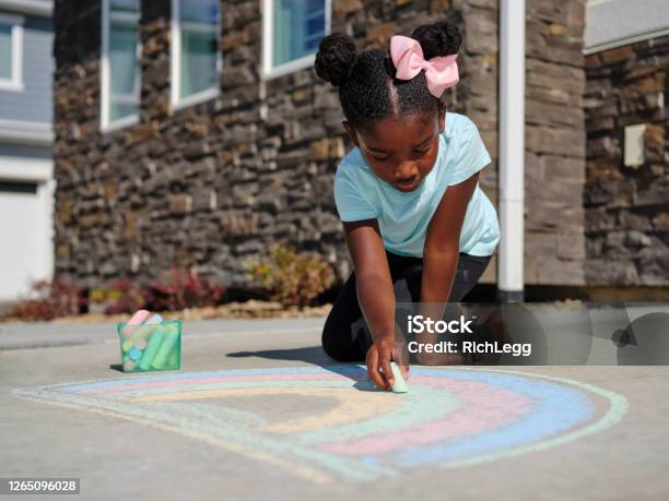 Little Girl Drawing With Sidewalk Chalk Stock Photo - Download Image Now - Chalk Drawing, Chalk - Art Equipment, Sidewalk