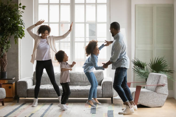 istock Overjoyed biracial family with kids have fun dancing 1265096845