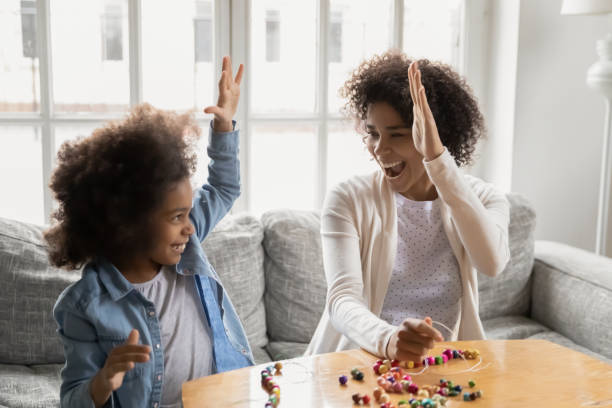 istock Happy biracial mom and daughter engaged in creative activity 1265096857
