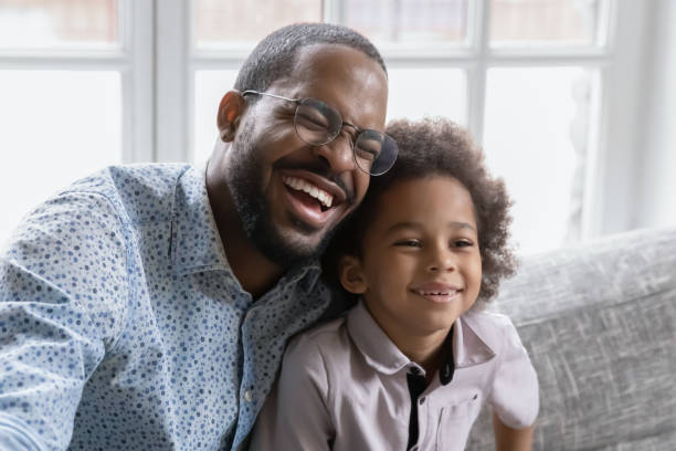 istock Overjoyed biracial dad and son have fun at home 1265096868