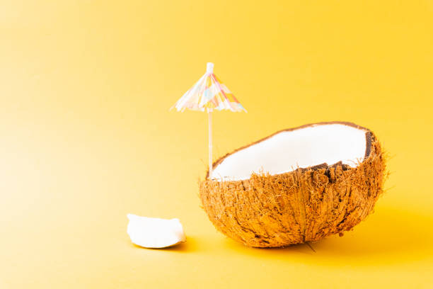 istock fresh coconut and sun umbrella 1265097784