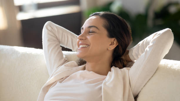 istock Young attractive woman relaxing on comfortable couch. 1265099317