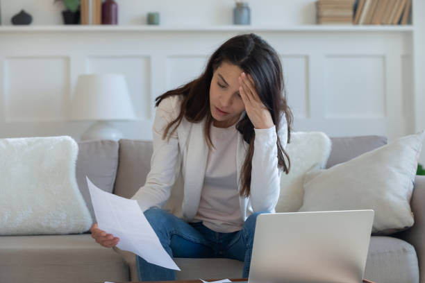 istock Stressed young lady thinking of financial problems. 1265099393