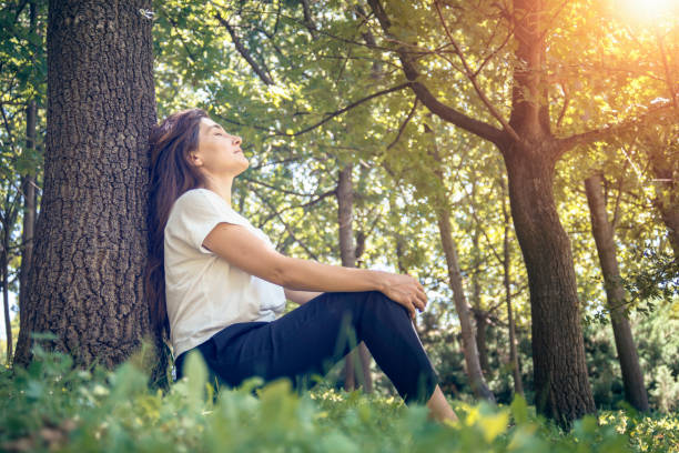 istock Relaxed woman in the park 1265100406