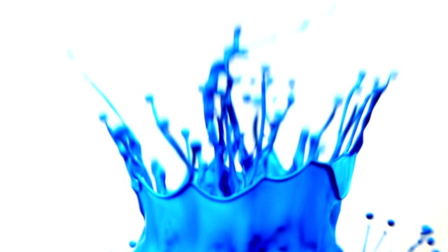 Close up colorful splashing paint in super slow motion.