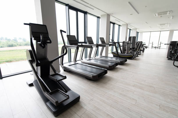istock Large Modern Gym With Workout Equipment 1265103844