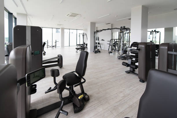 istock Large Modern Gym With Workout Equipment 1265103846