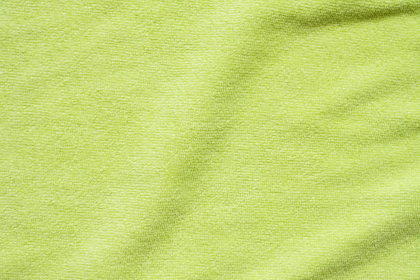 istock Green towel fabric texture surface close up background 1265104179