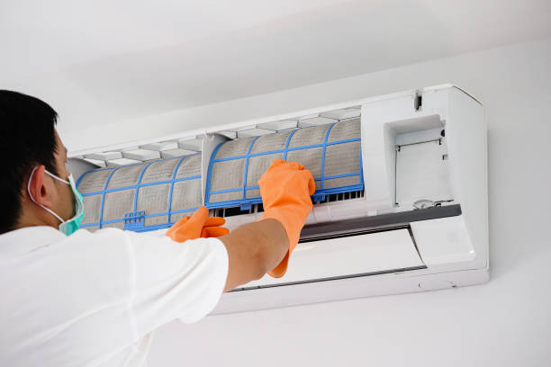 istock Asian man cleaning air conditioner dirty filter 1265104809