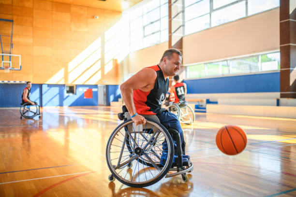 istock Wheelchair Basketball Player Retrieving Ball 1265105884