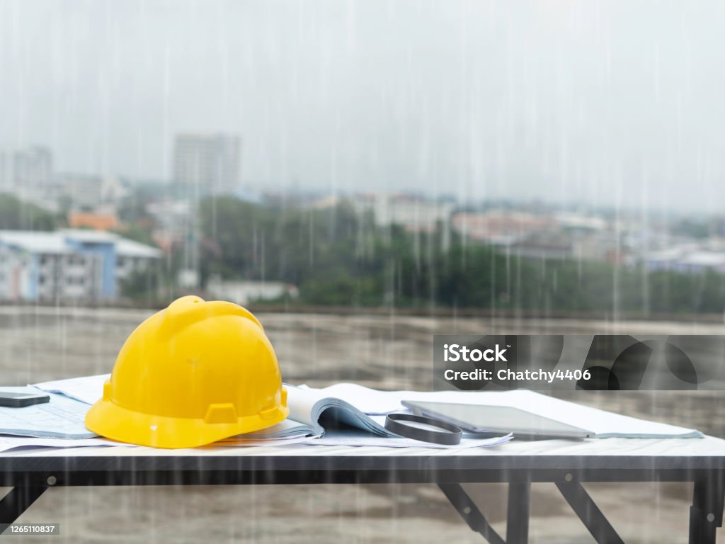 Engineering outside construction raining Rain Stock Photo