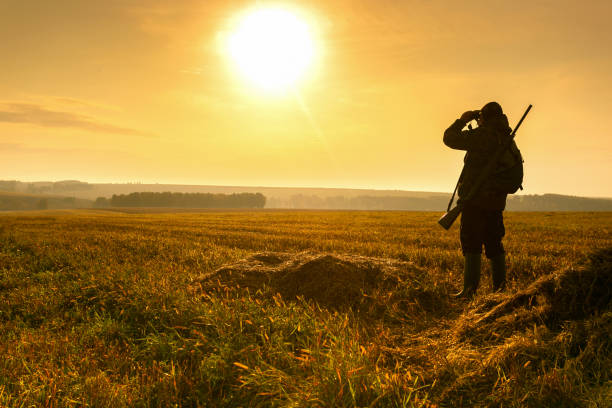 istock Bird Hunting - Silhouette Hunter At Sunrise. 1265111744