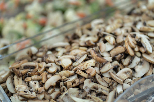 istock frozen mushrooms on the counter in the store 1265112352