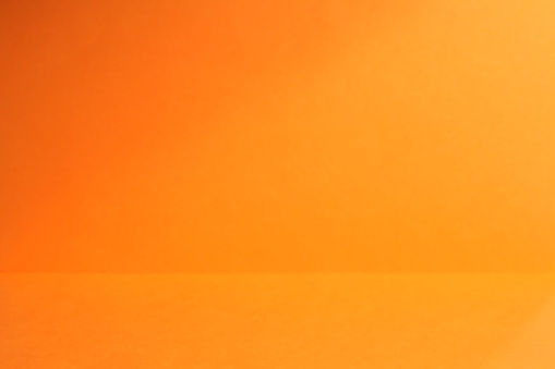 Orange Color paper texture as background.