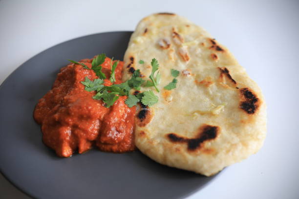 istock butter chicken and garlic naan 1265118509
