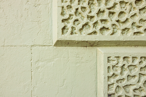 Part of a green colored concrete wall