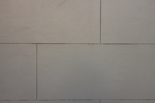 Part of a gray colored concrete wall