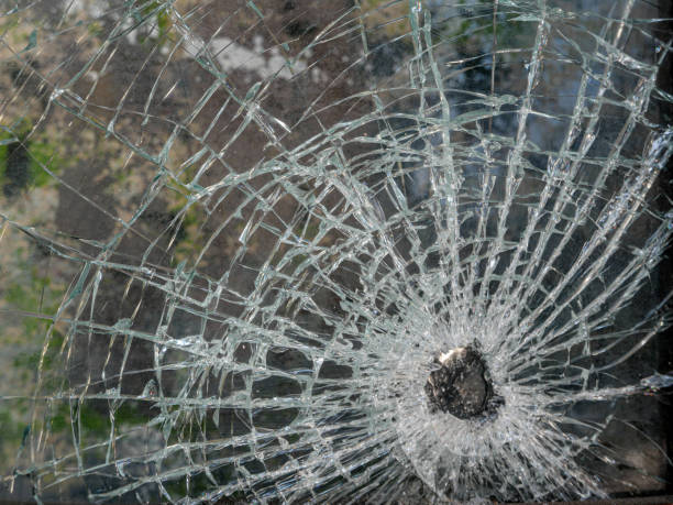 istock Bullet Hole in Glass 1265130758