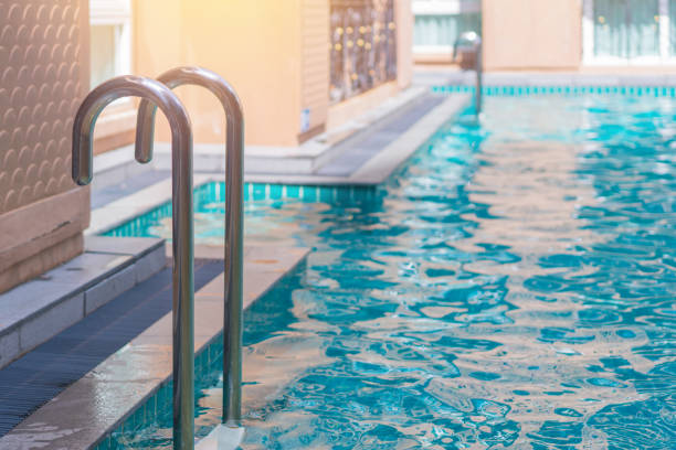 istock blue swimming pool at hotel with stair 1265133867