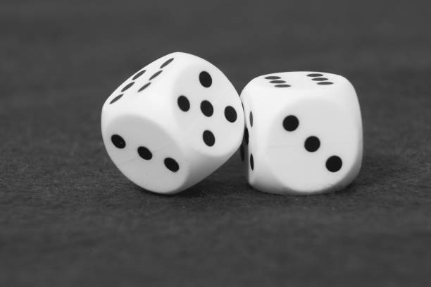 white playing dices on dark surface. black and white photography - 1474 imagens e fotografias de stock