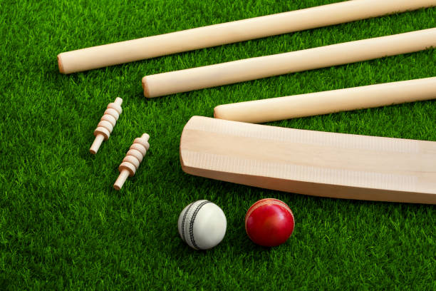 istock cricket set bat ball stumps and bails on green grass pitch background 1265144978