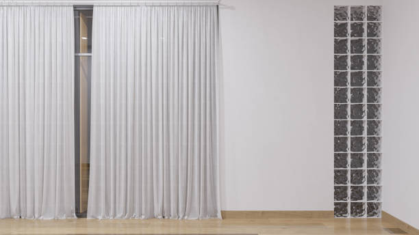 istock Interior Wall with Curtains and Glass Bricks Inside an Empty Illuminated Room 1265145655
