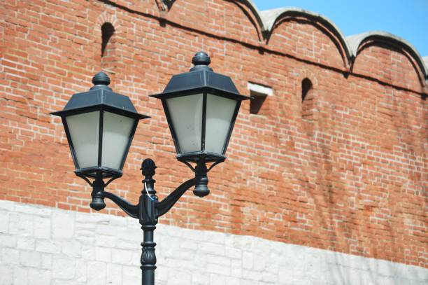 Old Tbilisi architecture. The bricks wall and  street light in summer day.